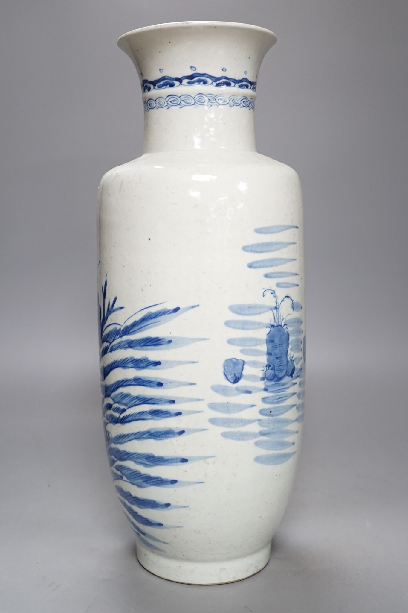 A Chinese blue and white rouleau vase, 42 cm